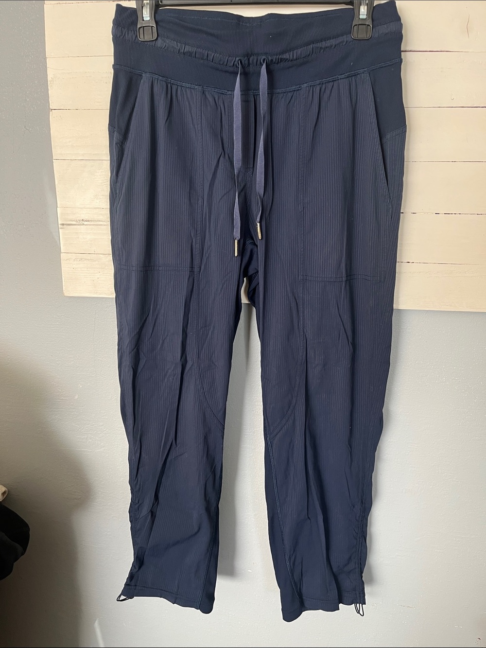 Lululemon Dance Studio pants in a navy blue ribbed fabric.